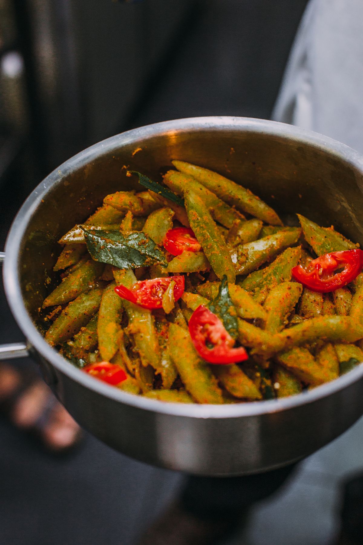 Pasta with tomatoes and herbs cooking in a pan