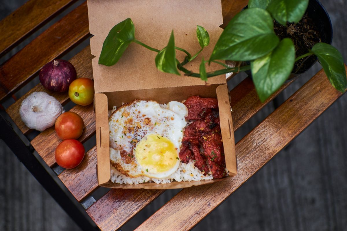 Prepared meal served in a takeout container