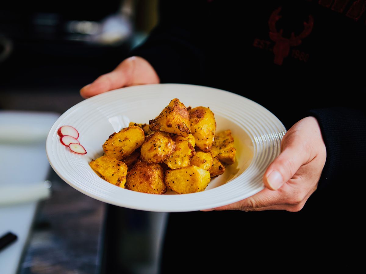 Freshly cooked golden potatoes served on a plate