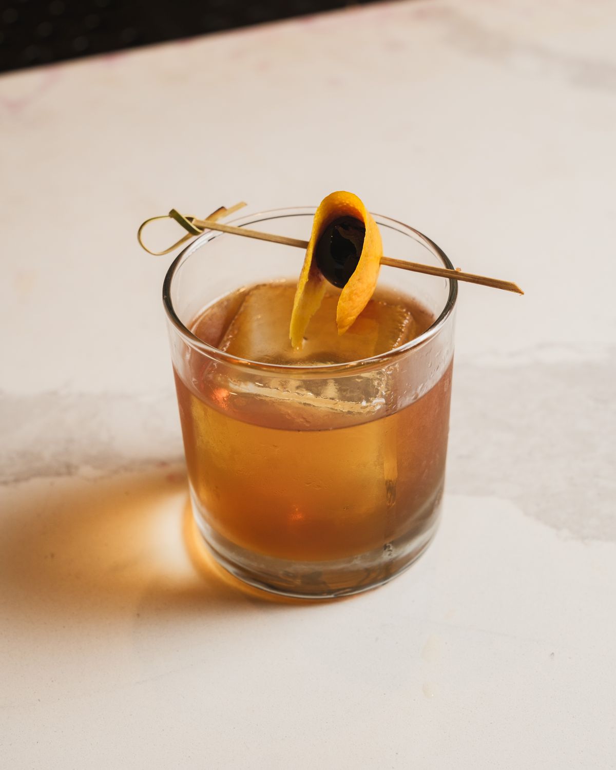 Classic Old Fashioned with orange twist and cherry