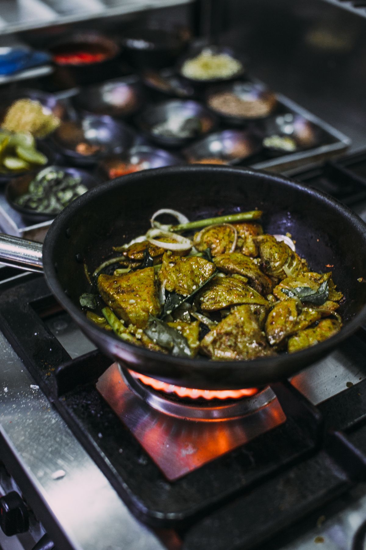 Seasoned chicken cooking in a hot frying pan